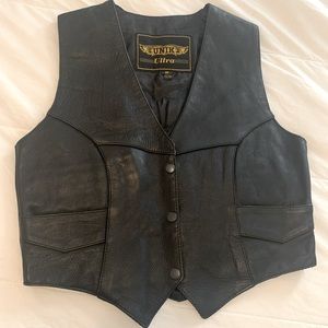 Black leather motorcycle vest with Harley Davidson Screaming Eagle Patch